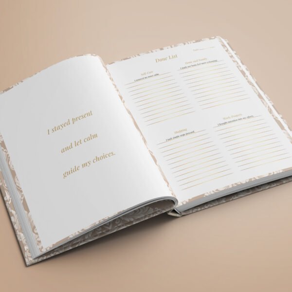 Hardcover physical planner open at Done List daily page with premium paper and calm design