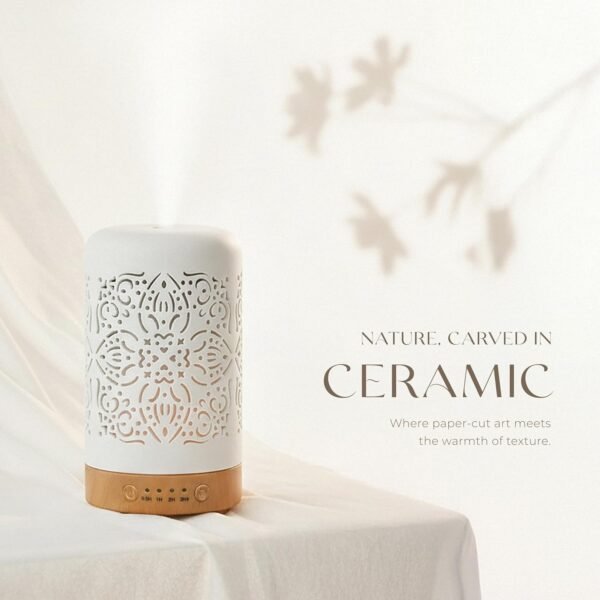White ceramic essential oil diffuser with carved pattern and warm minimal home aesthetic