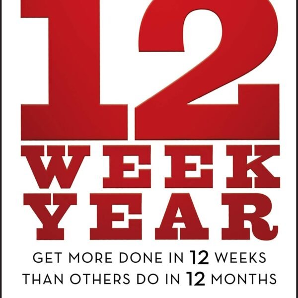 The 12 Week Year by Brian P. Moran and Michael Lennington book cover in a minimalist CalmDone reading space.