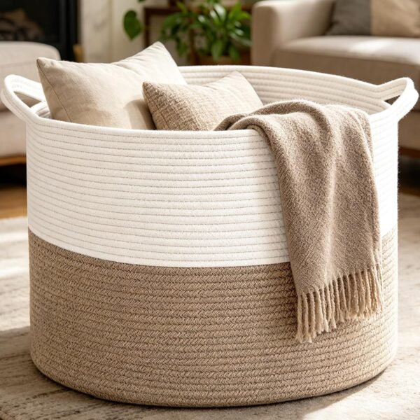 Large woven cotton storage basket with blankets and pillows in a cozy living room