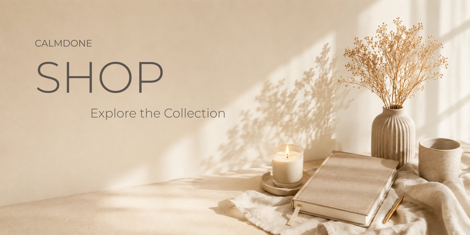 Minimal beige lifestyle scene with manifestation planners, cozy candle, and calming home decor for intentional living
