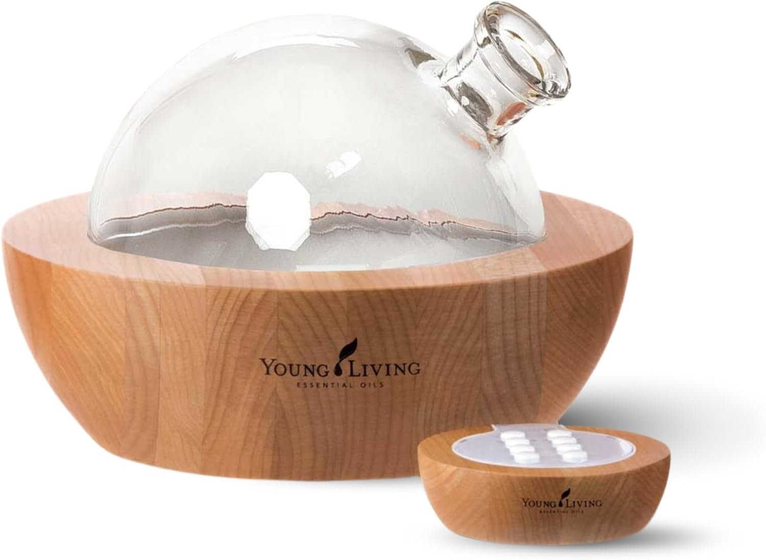 Young Living Aria ultrasonic essential oil diffuser with glass dome, wood-grain base, and remote control